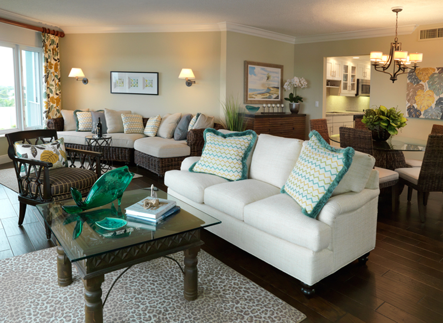 Delray Waterfront condo remodel in an Island theme with dark wood floors, rattan and teal fabric